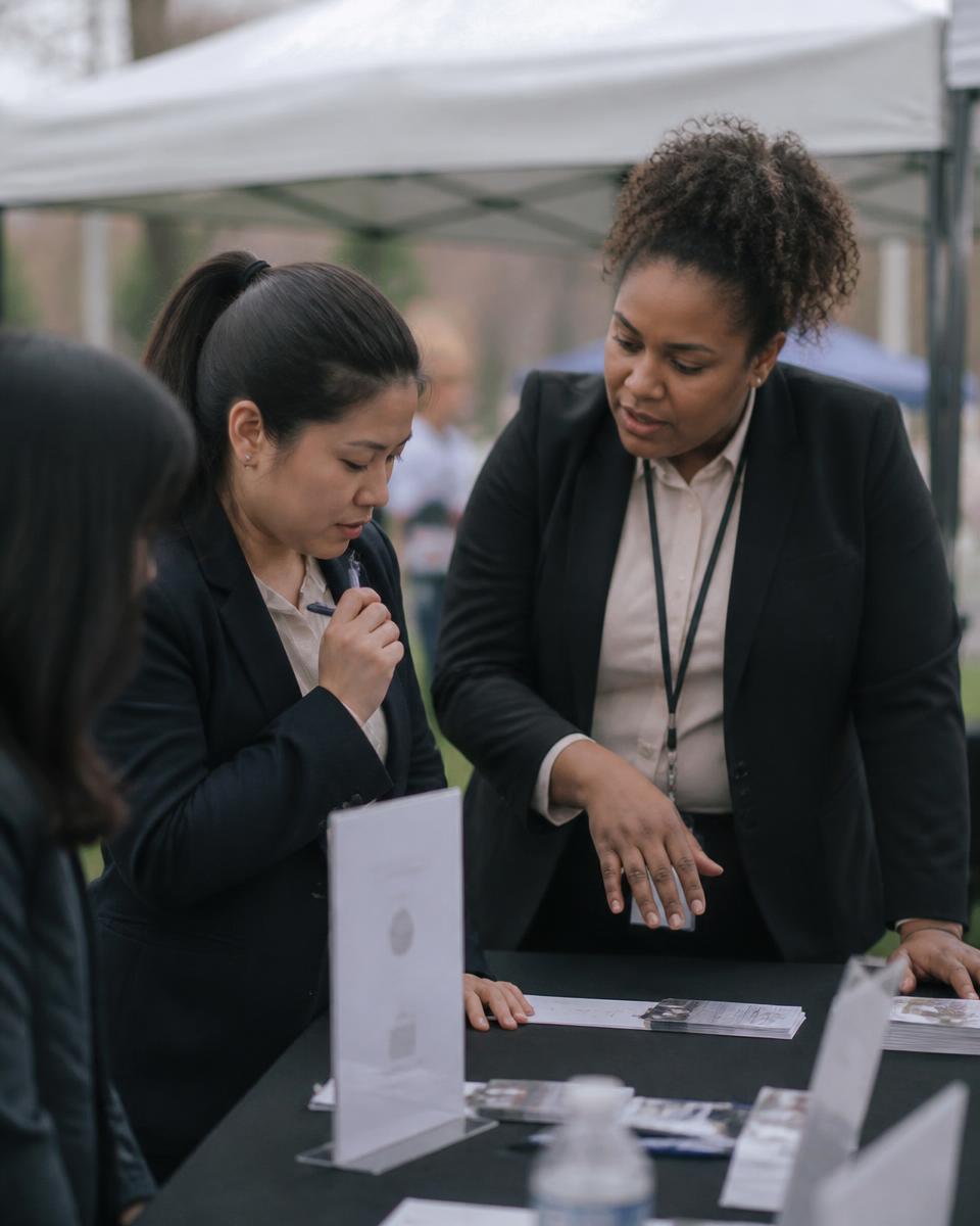 Two team members training together at an outdoor event